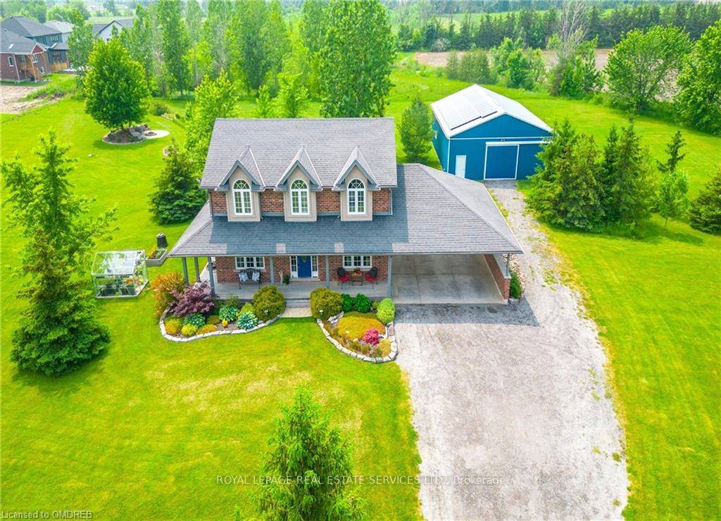 This custom built, all brick two storey home is set on 13 breathtaking acres, offering a rare blend of natural beauty and modern comfort.
