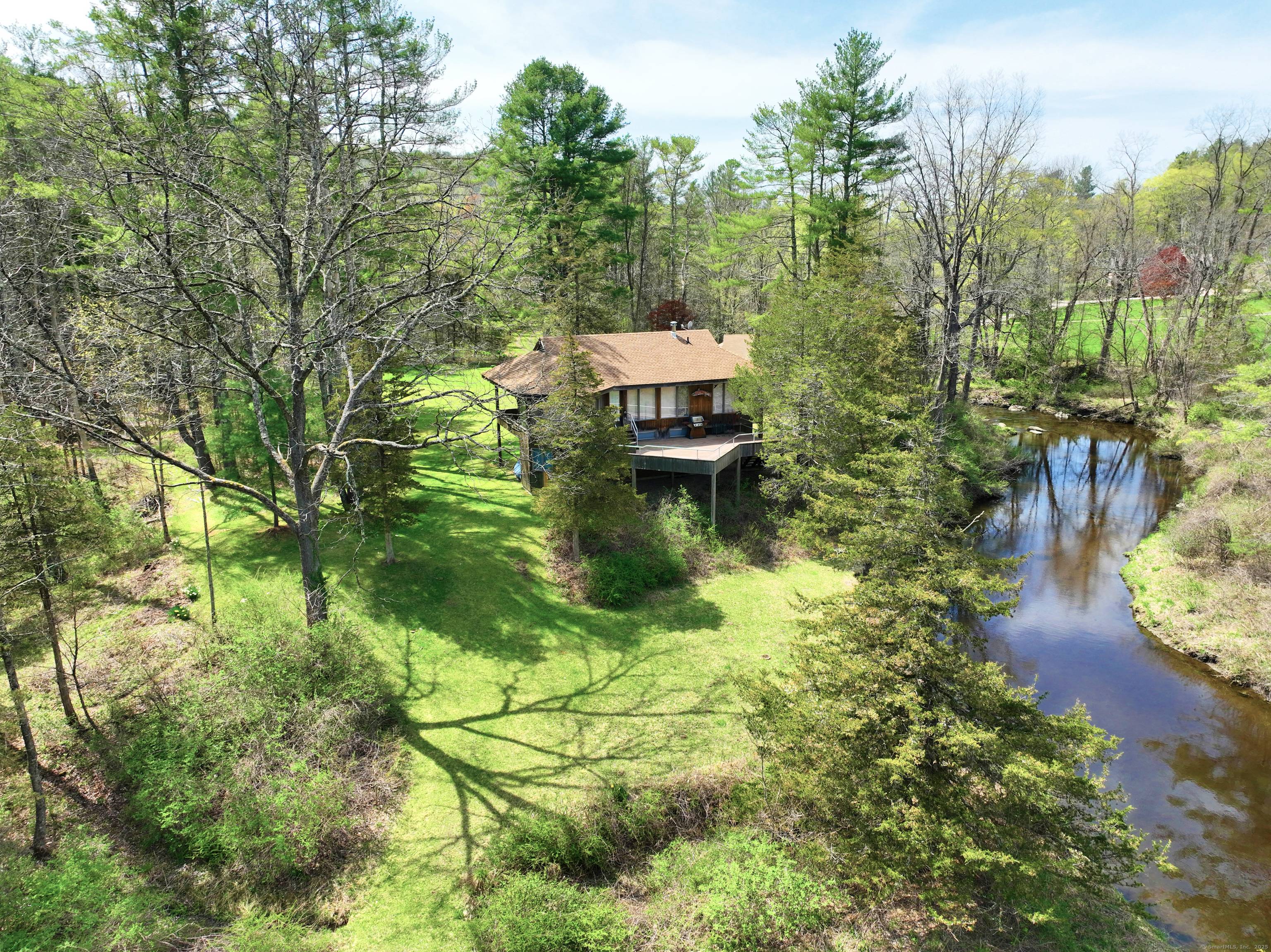Enchanting Riverside Retreat in Falls Village Nestled along the banks of the Hollenbeck River, this contemporary home at 185 Route 63 offers a serene sanctuary where nature and architecture become ...