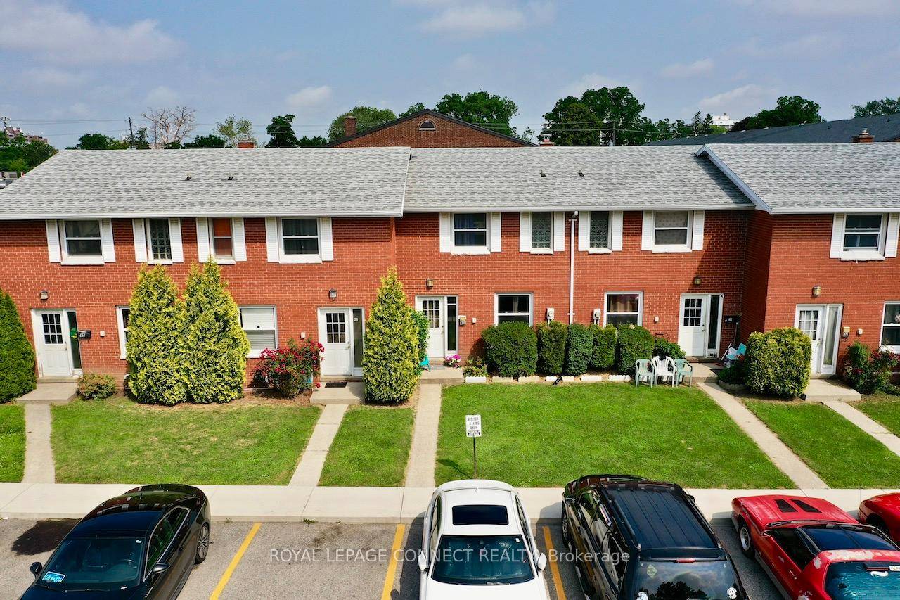 All brick centrally located well established 2 storey, 3 bedroom, 2 washroom condominium townhome with own exclusive parking, and sizeable useable unfinished basement, laundry area, and gas forced air heating.