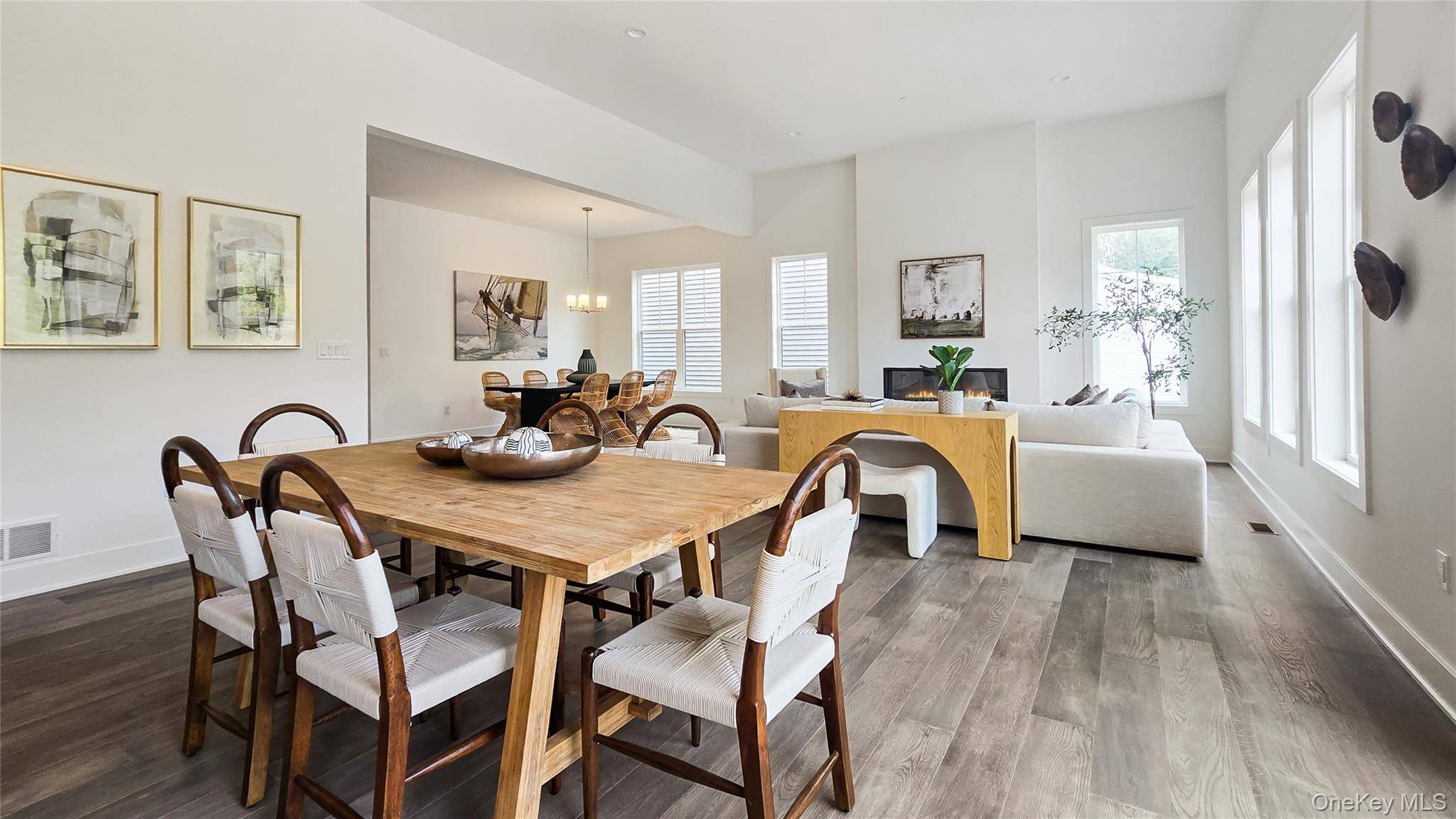 A welcoming foyer punctuated by a tray ceiling leads past a versatile flex room into the main living area, featuring an elegant dining room and a spacious great room.