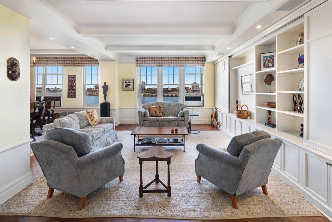 Perched high above Riverside Drive, this beautifully appointed three bedroom, two and a half bath residence offers sweeping panoramic views of the Hudson River and Riverside Park.