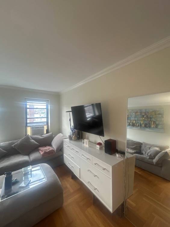 Bright Top Floor Big Corner 1 Bedroom in Full Service West Village Building Available for a 9 10 month term plus option to renew.