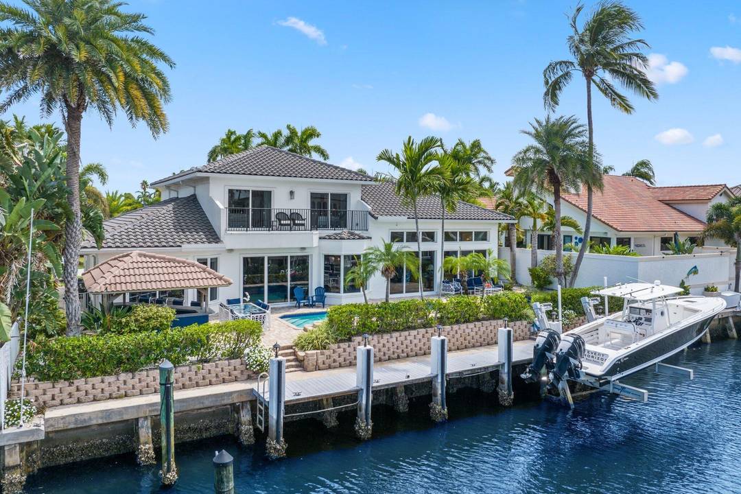 Experience the pinnacle of waterfront luxury in Delray's coveted Tropic Isle.