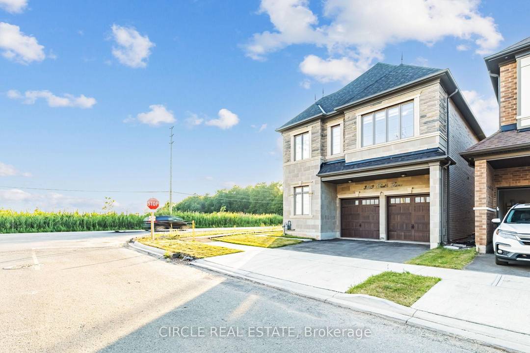 An Executive Detached Home With A Brick And Stone Exterior On A Premium Corner Lot.