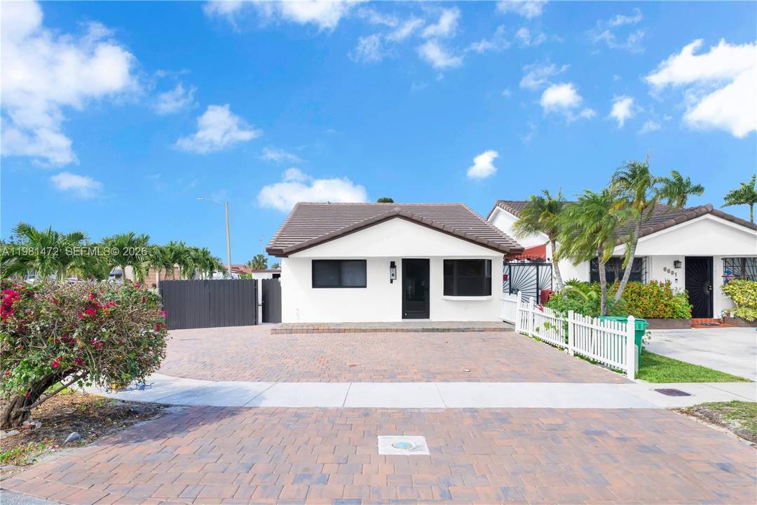 Charming corner Hialeah Gardens 3bedroom 3 bathroom home, brand new flooring throughout, new paint inside and out, roof is 5 years old, brand new kitchen cabinets, new bathrooms, new built ...