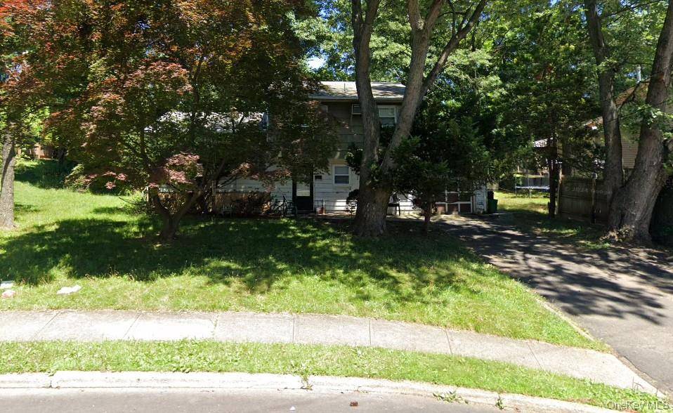 Welcome to 20 Charles Lane, a unique opportunity in the heart of Spring Valley.
