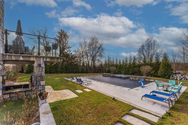 Located in the Riker Hill section of Livingston, this custom built residence offers a well designed layout with a range of interior and exterior amenities.