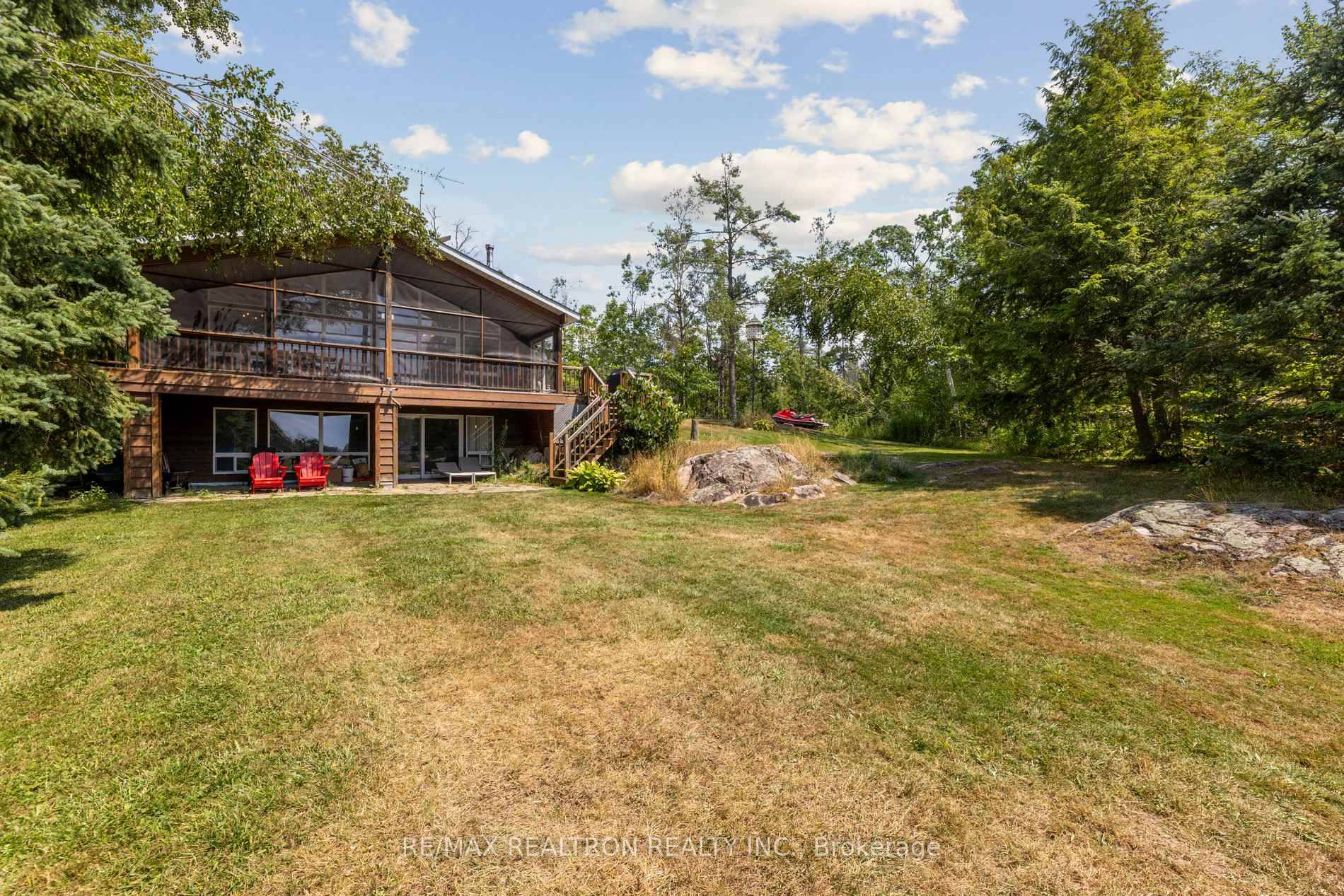 Welcome to 383 Philrick Drive a rare opportunity to own a fully furnished, turnkey waterfront home on the highly desirable Big Bald Lake in the Kawarthas.