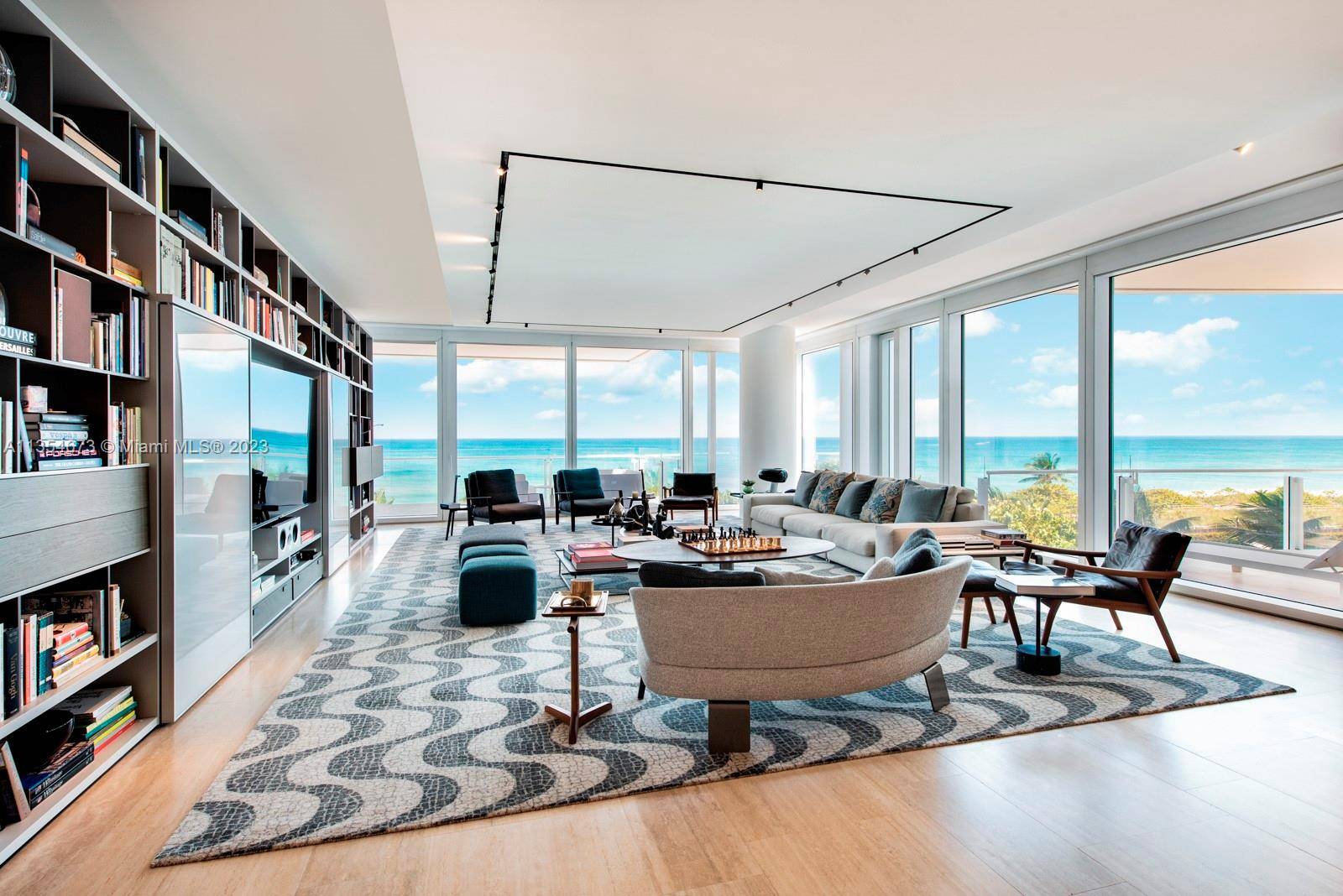 Welcome to this rarely available, oceanfront and spacious corner residence at the Surf Club Four Seasons.