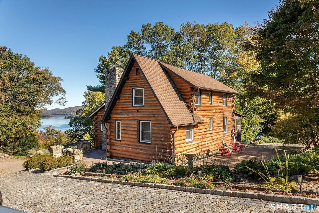 Come experience Candlewood Isle living and everything the community has to offer in a vintage cedar log home at the end of a cul de sac overlooking Candlewood lake.