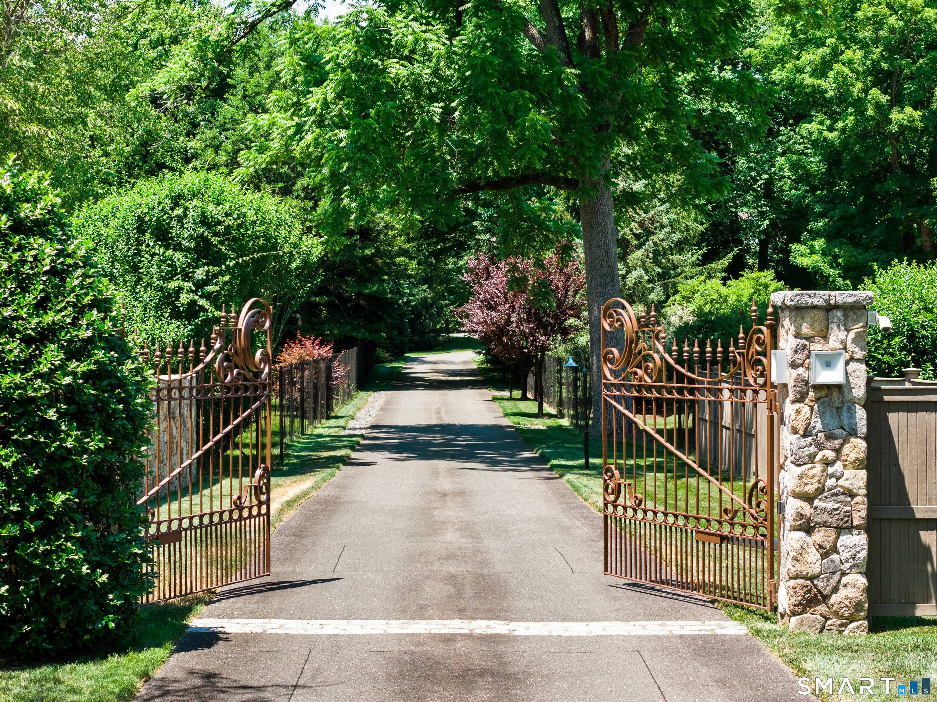 Tucked behind elegant wrought iron gates at the end of a long private driveway, this exceptional Greens Farms estate offers the perfect blend of privacy, luxury, and convenience in one ...