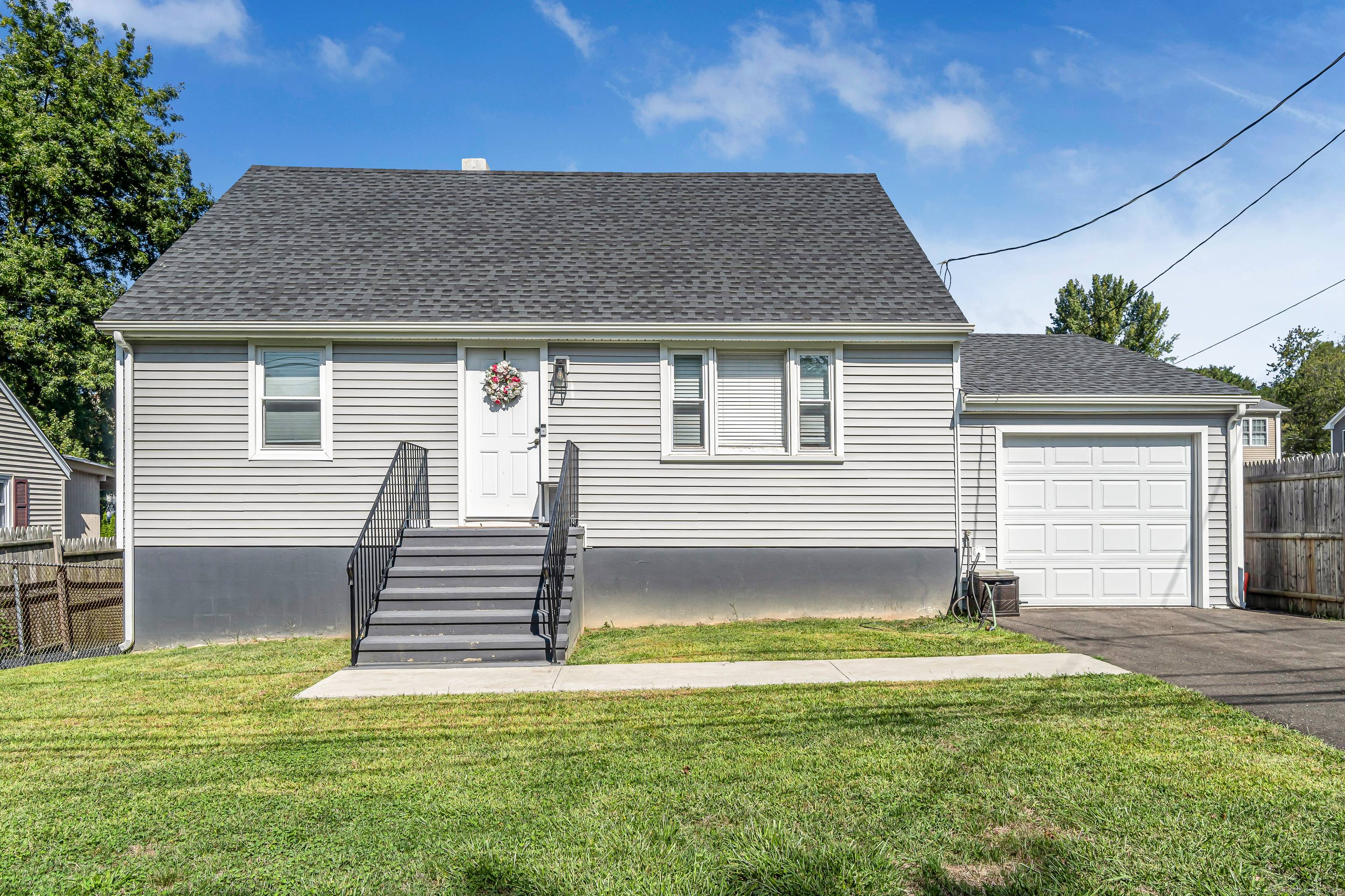 This exceptional Cape Cod style home combines classic charm with a modern flair.