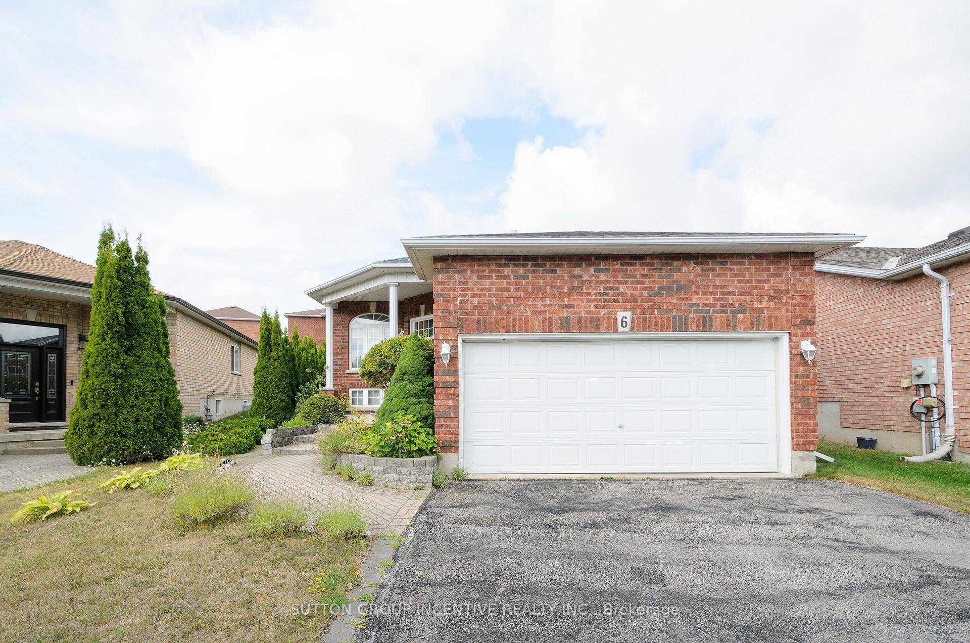 This stunning raised bungalow is tucked away in a quiet, family friendly neighborhood.