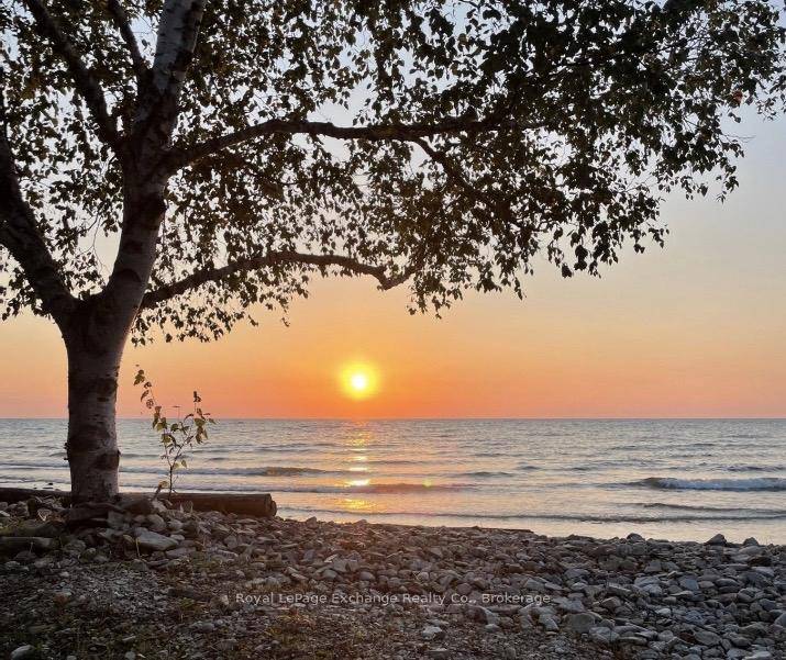Tucked among mature cedars and offering 75 feet of pristine Lake Huron waterfront, this executive custom built home 2011 combines timeless craftsmanship, modern comforts, and breathtaking natural beauty.