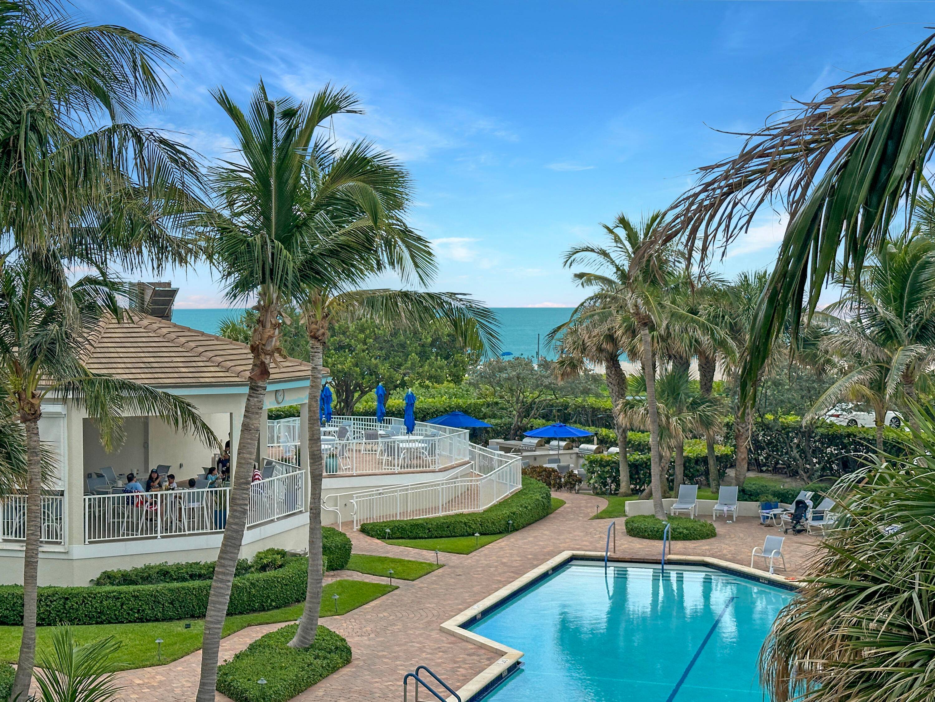 Inviting, furnished 2BR, 2BA condo with ocean and palm tree views.