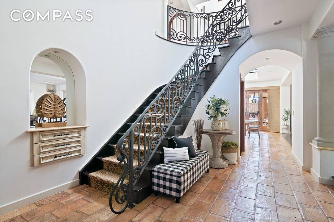 Luxury living surrounded by breathtaking water views awaits in this four bedroom, three and a half bathroom Mediterranean showplace on one of Bay Ridge's loveliest streets.