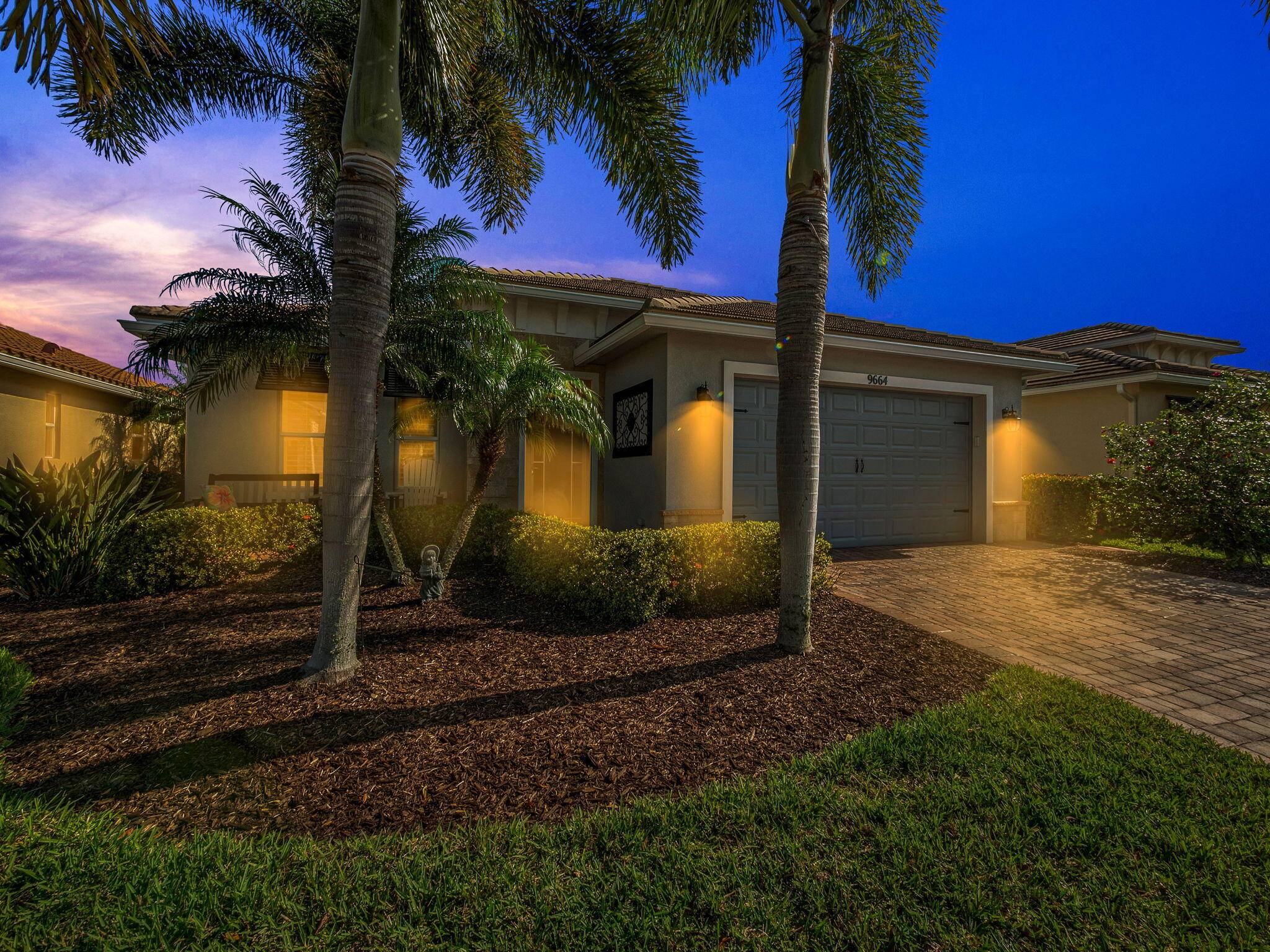 Welcome to this charming 2 bedroom den, 2 bathroom Sanibel Model home, ideally situated on the water in the highly sought after Vitalia at Tradition community.