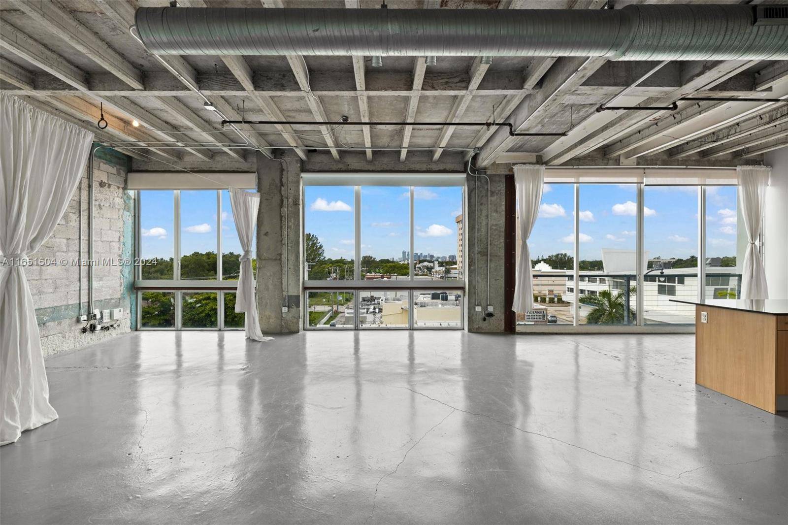 LIVE Work Loft ! ! ! Modern, spacious loft with gorgeous polish concrete floors and floor to ceiling impact glass sliding windows amp ; doors.