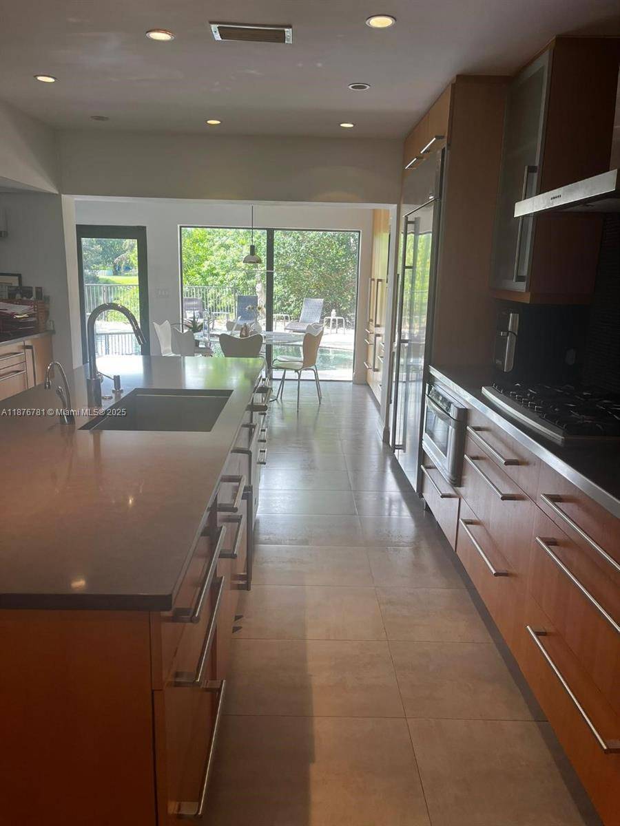 4 3 Lakefront home on. 35 acre with lake views from living room, kitchen, family room, master suite, pool amp ; patio.