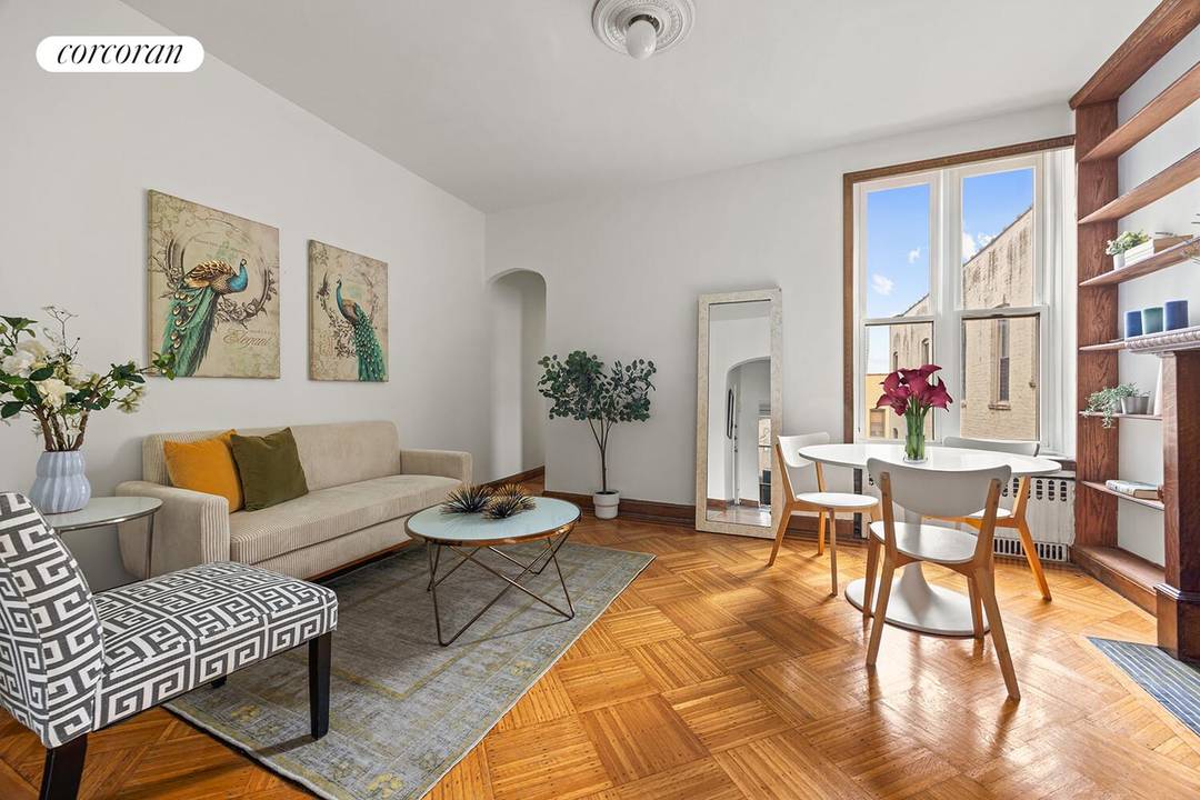 TOP FLOOR CHARMER ! This ideally located pre war 1 bed home office has so much to offer original parquet floors, a windowed kitchen, 9'4 tall ceilings, a gorgeous decorative ...