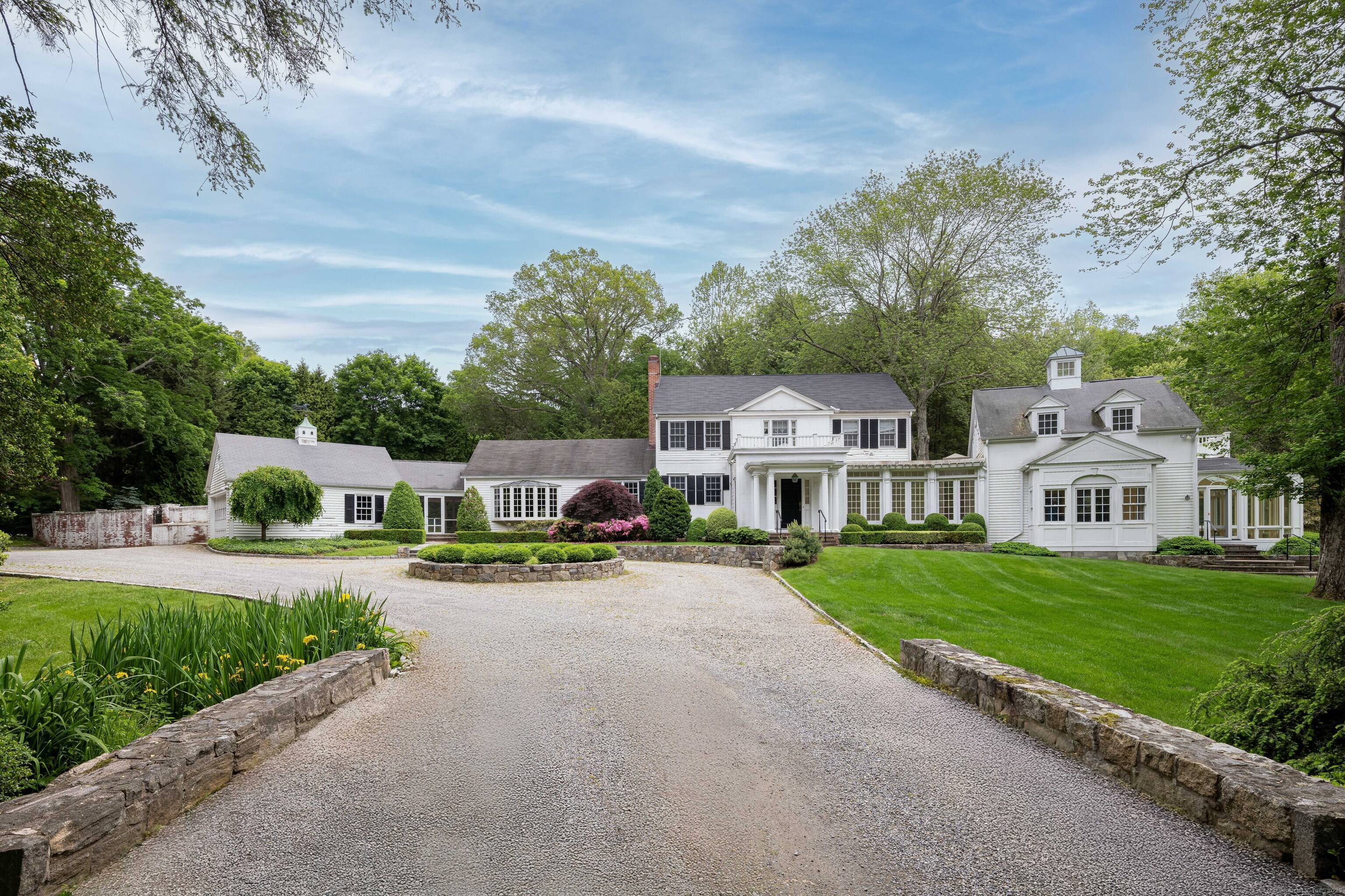Unique opportunity to renovate this classic Westport estate on three professionally landscaped acres with a pool.