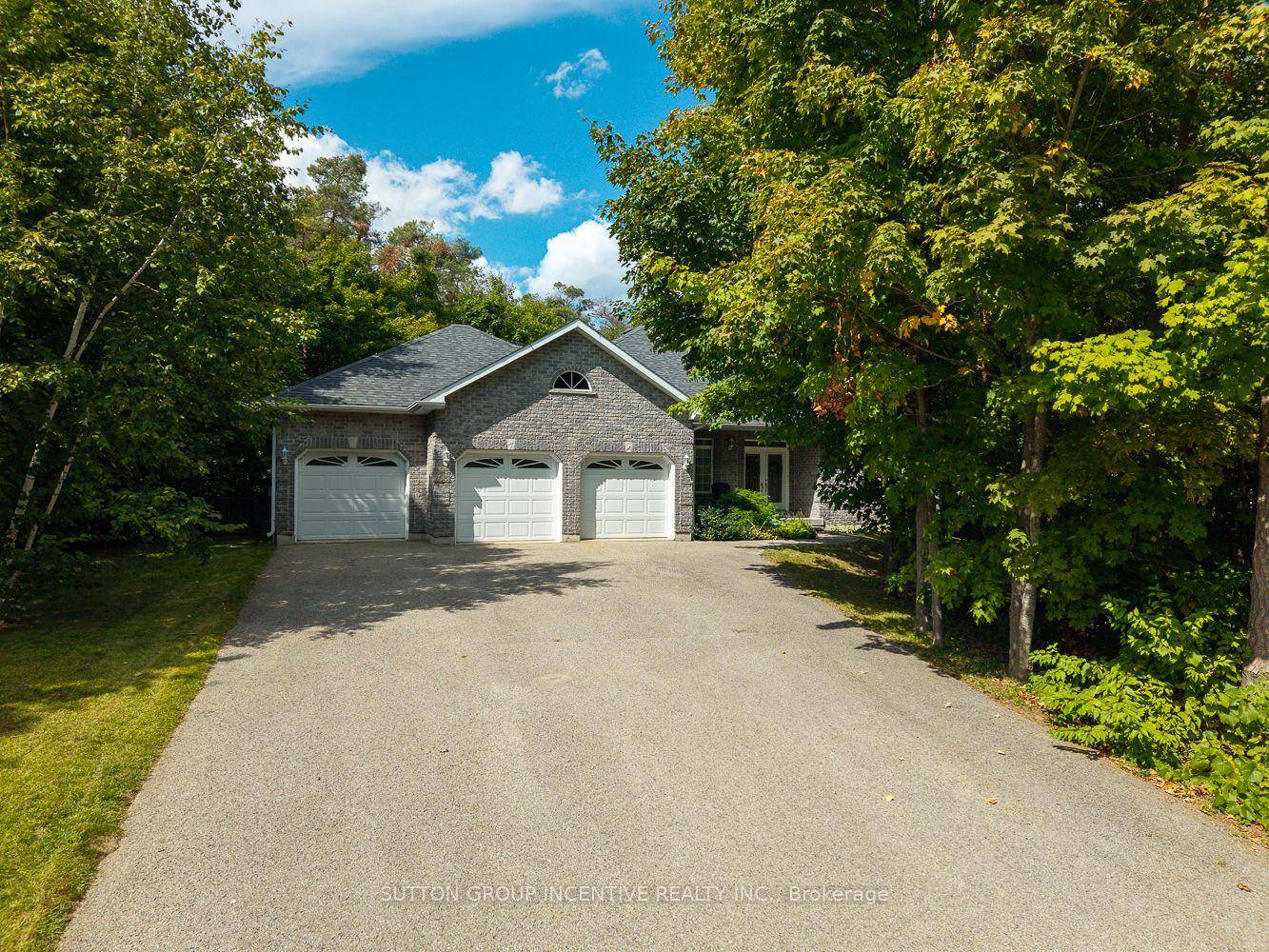Welcome to 1882 Providence Lane, a beautiful bungalow nestled on a private estate lot in the sought after community of Marchmont.