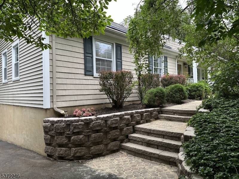 Immaculate custom 10 room home situated on a serene and private lot, this exceptional residence offers a refined living experience with 4 spacious bedrooms and 3 full baths.
