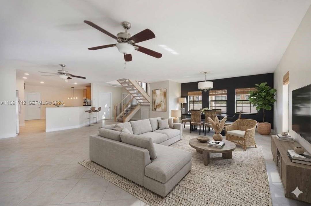 Set in the gated enclave of The Oaks at Hidden Harbour, this spacious townhome offers 3 upstairs bedrooms including a large primary suite with a private balcony.