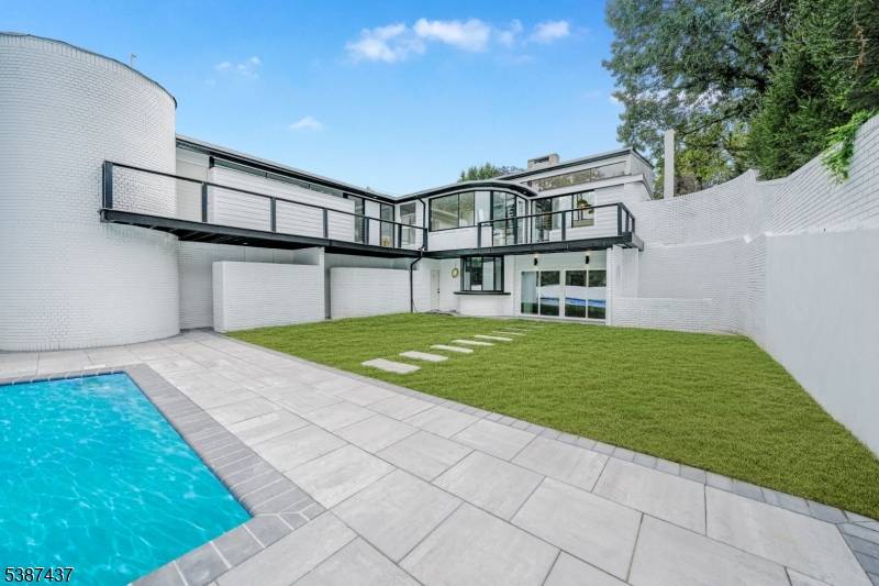 A rare opportunity to own a stunningly renovated 5BR 5BA contemporary retreat in the heart of West Orange.