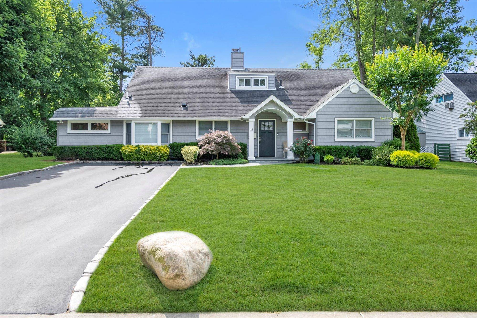 Welcome to 14 Ridge Drive East, Roslyn a spacious and expanded 5 bedroom, 2 bathroom ranch, newly renovated in 2019, nestled in the highly desirable Flower Hill community.