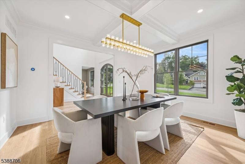 Welcome to 17 Hilltop Terrace, where impeccable design meets modern luxury in one of Chatham Township's most coveted locations.