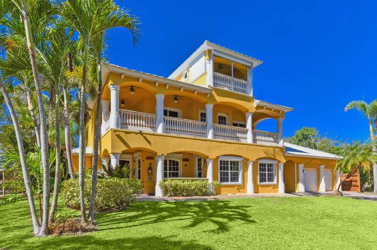 3 Acre Riverfront Home, Attached 2 Car Garage and Detached 1, 600 Sq Ft 4 Car Garage with A C, Featuring Bath, Gym, and Workshop, Generator, Carport, and concrete pad, ...