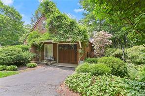 Storybook 3 bedroom furnished cottage in South Wilton with tennis court, 2 acres of manicured grounds, and gazebo.