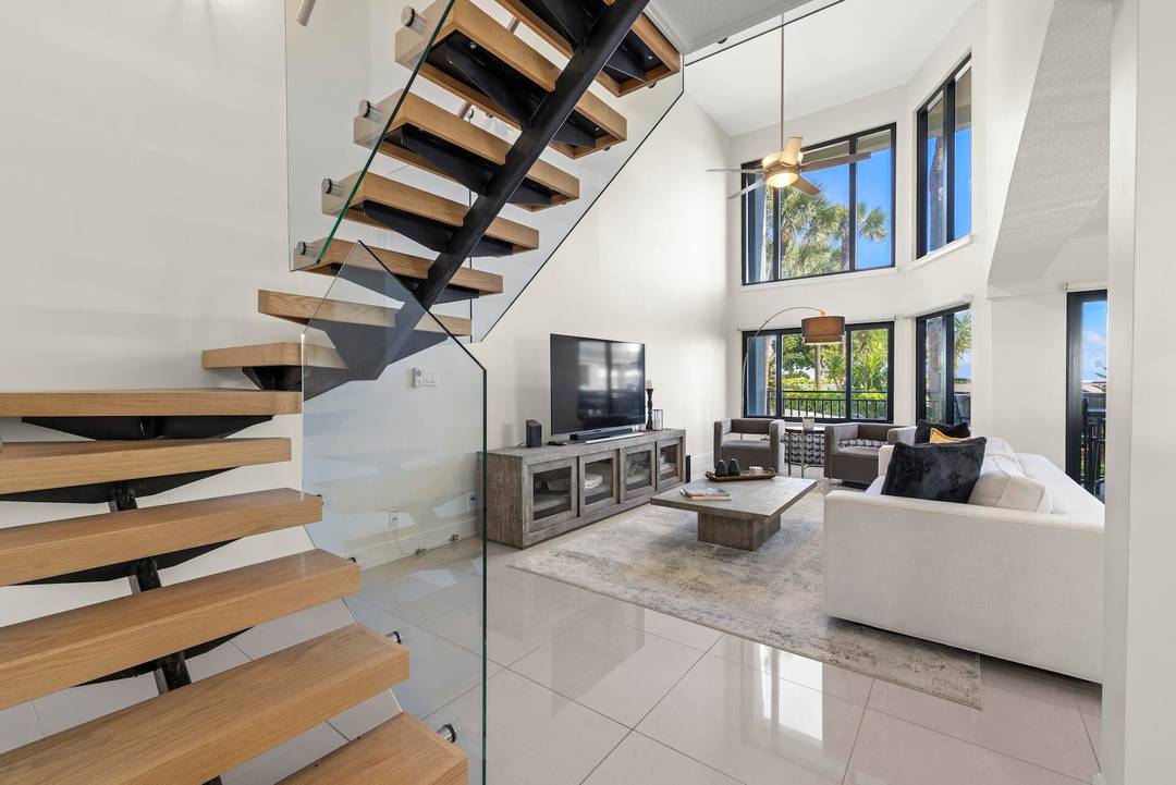 Beautifully renovated two story condo that lives like a townhouse just steps away from the beach !