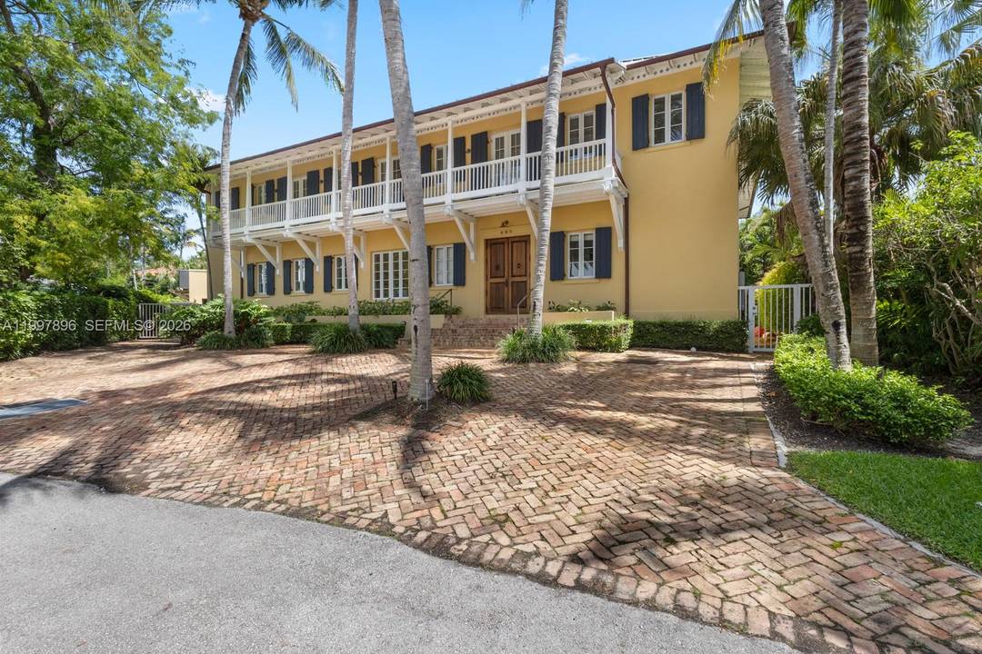 Timeless colonial style residence, also known as Villa Rosa, set on a rare 12, 200 sqft lot in the heart of Key Biscayne.