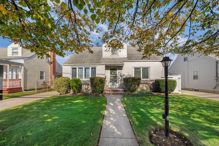 Welcome to this lovely four bedroom, two full bathroom Cape in Carle Place.