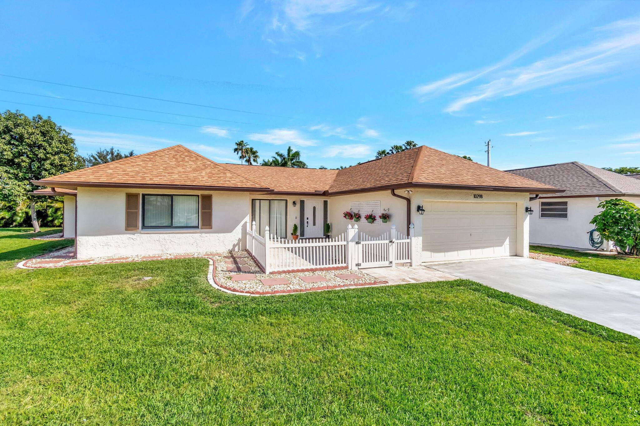 55 This very lovely home is located on Pine Tree Village, a hidden gem of a quiet active adult community.