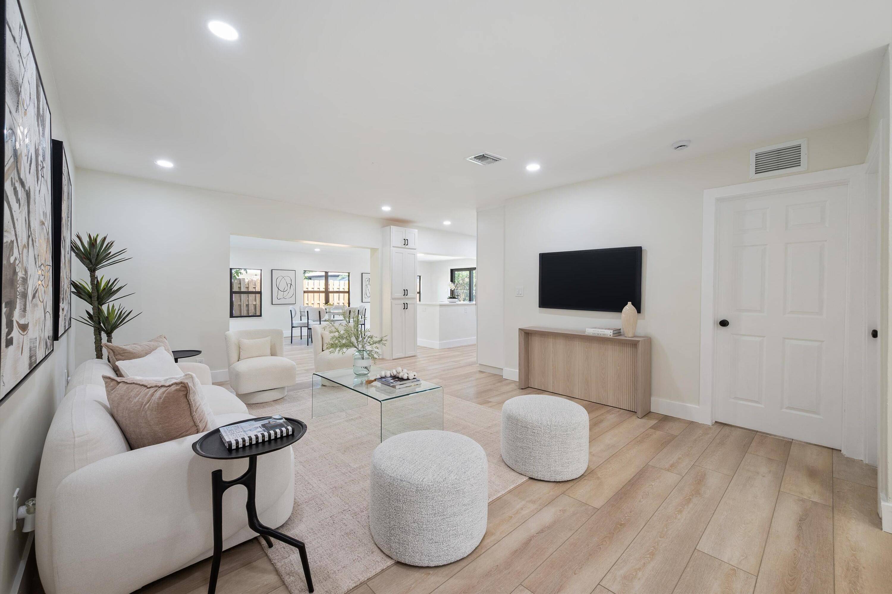 FULLY RENOVATED 4 BED, 3 BATH CORNER LOT HOME WITH IMPACT GLASS, 2 CAR GARAGE CIRCULAR DRIVEWAY !