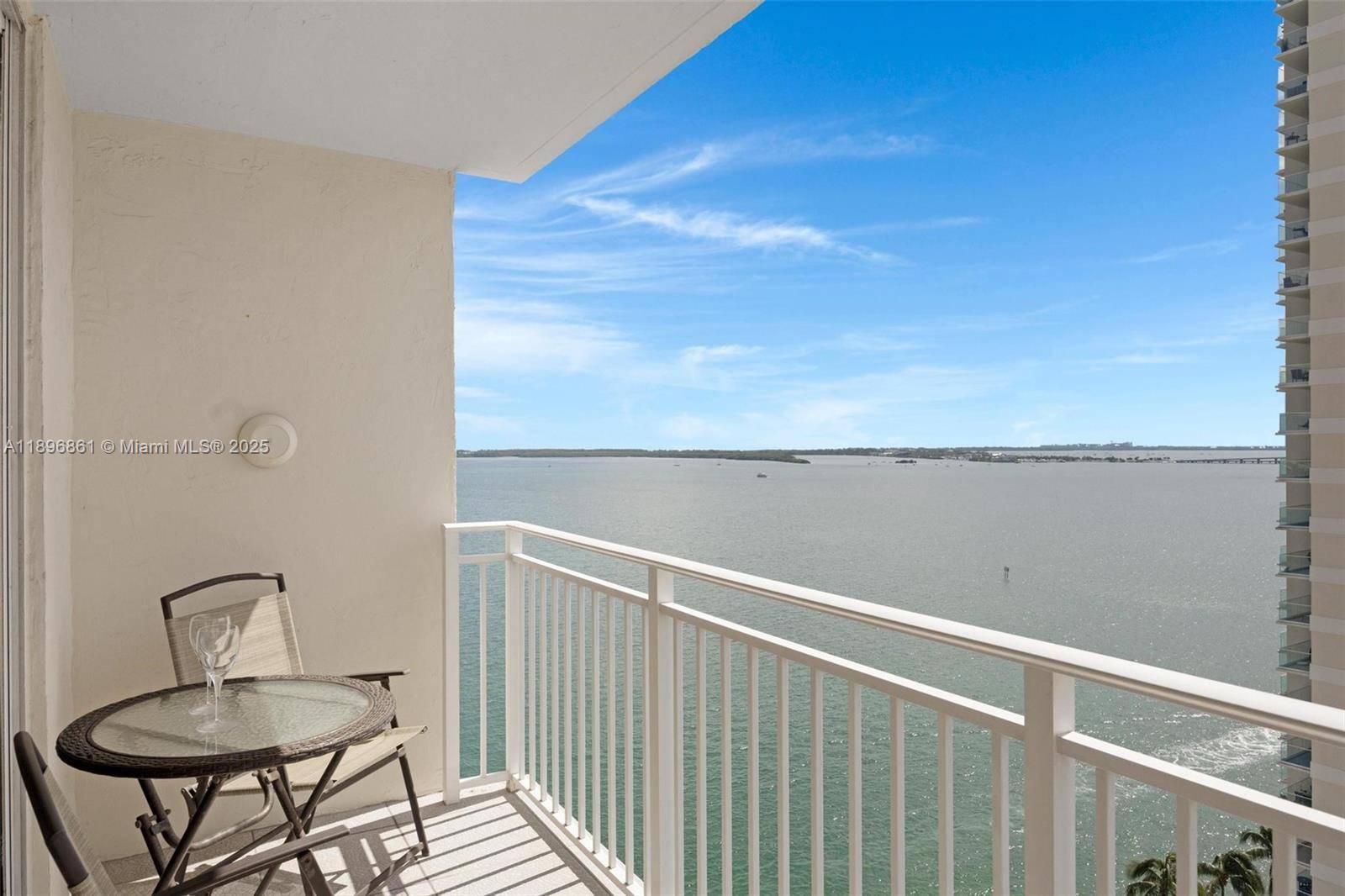 Live the island lifestyle on prestigious, private Brickell Key.