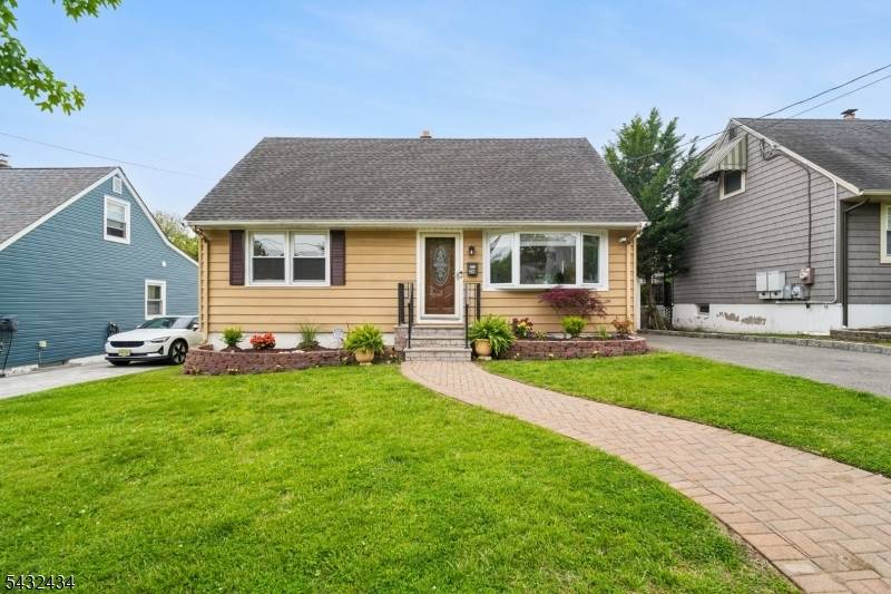 Welcome to this cozy cape nestled in Bloomfield's beloved Oakview community.