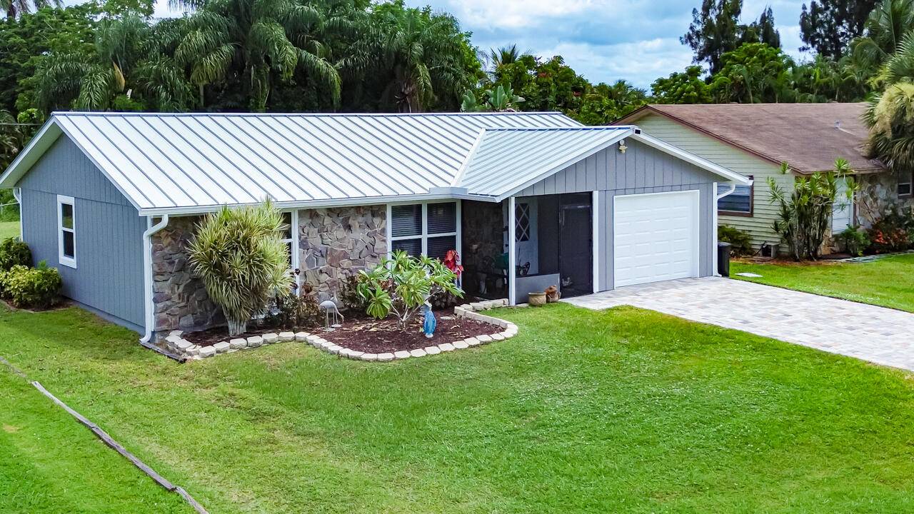 Fall in love with this move in ready gem in Stuart's desirable Hibiscus Park, where modern updates meet Florida charm.
