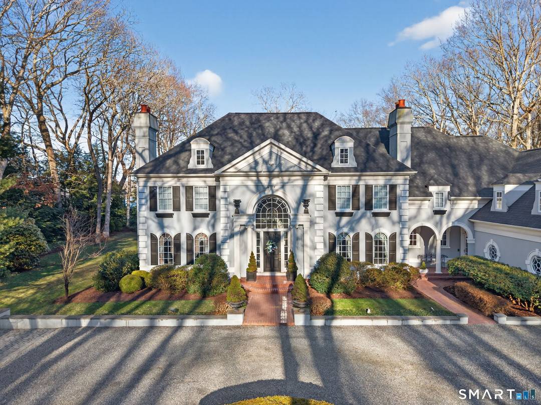 Riverside Elegance Meets Neoclassical Grandeur Experience the pinnacle of waterfront living in this breathtaking Grecian Colonial estate, perfectly situated on 3.