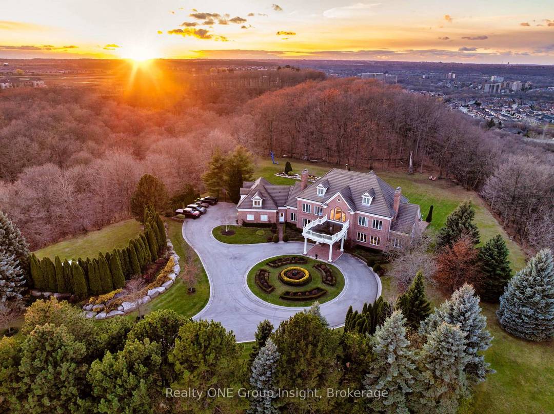 Perched atop the Escarpment and situated on a 16 acre peninsula, this stunning Georgian style estate offers over 7, 000 square feet of above grade living space.