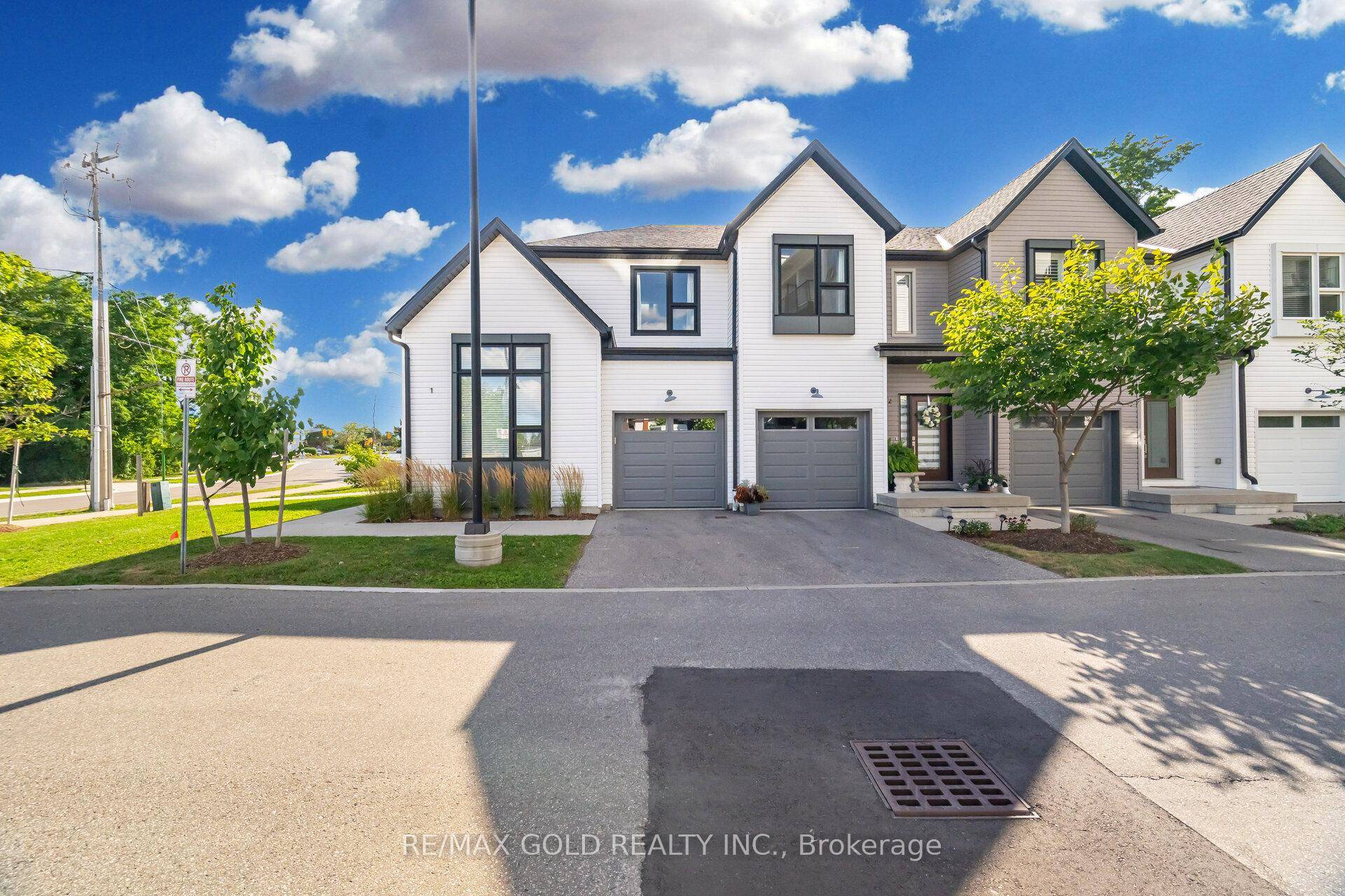 Exceptional corner end unit townhome with a rare spacious double car garage and over 1, 700 sq.