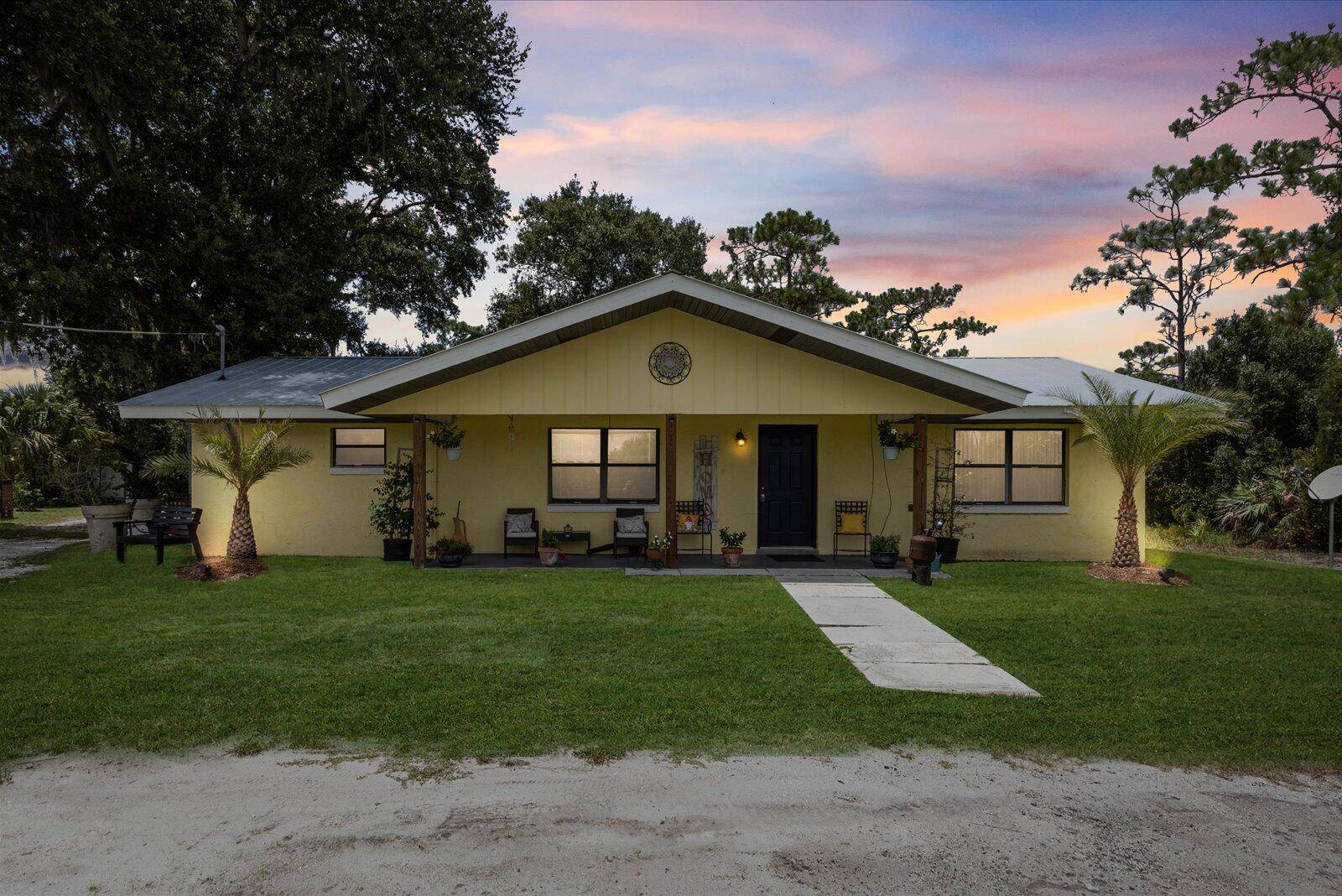 Step inside this charming 3 2 CBS home on a newly fenced 1 acre lot, plentiful with all kinds of fruit trees you will fall in love !