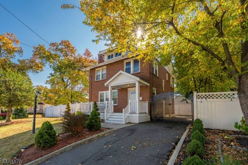 This property is a charming four bedroom, brick Colonial style home situated on a corner lot.
