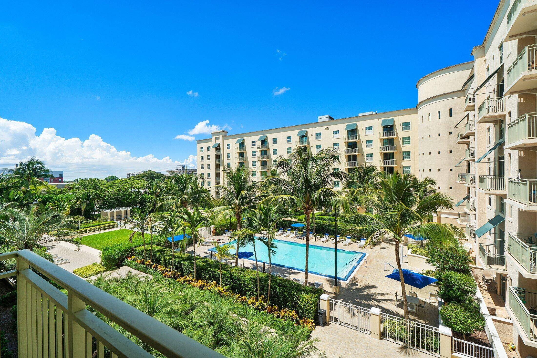 Impeccably maintained 2 bedroom 2 bath condo with balcony overlooking the pool greenspace.