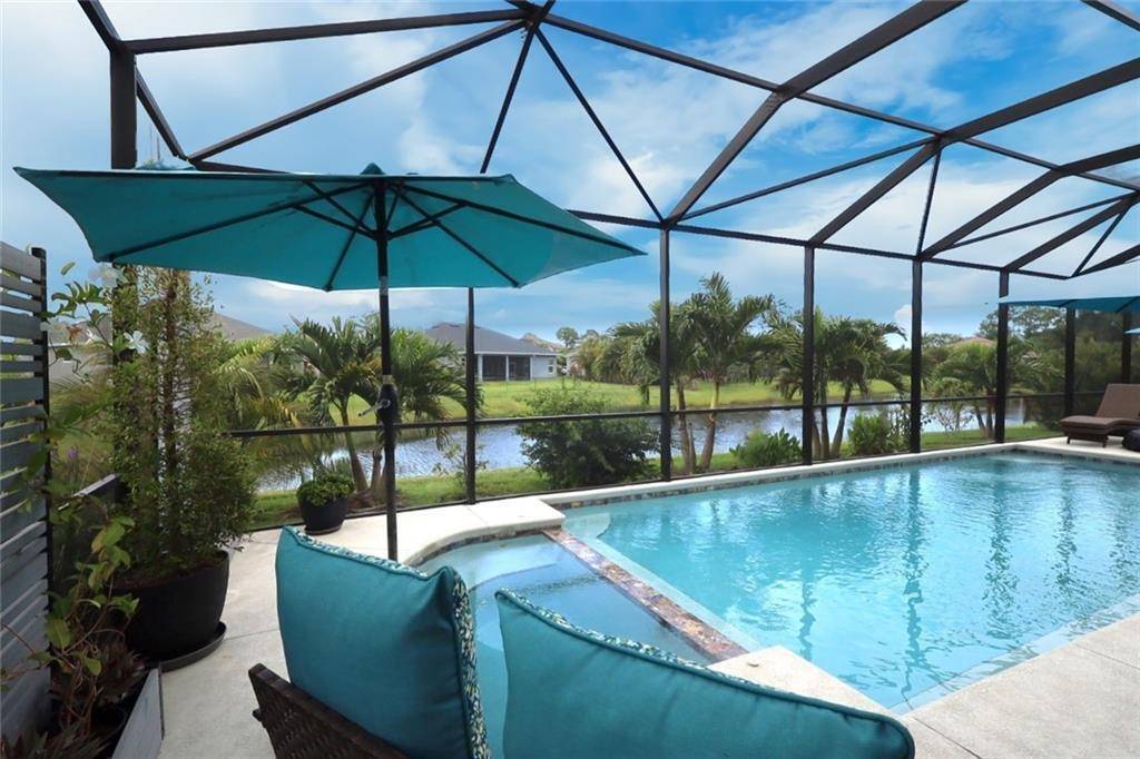 This custom built lakefront masterpiece showcases refined elegance impeccable craftsmanship at every turn.