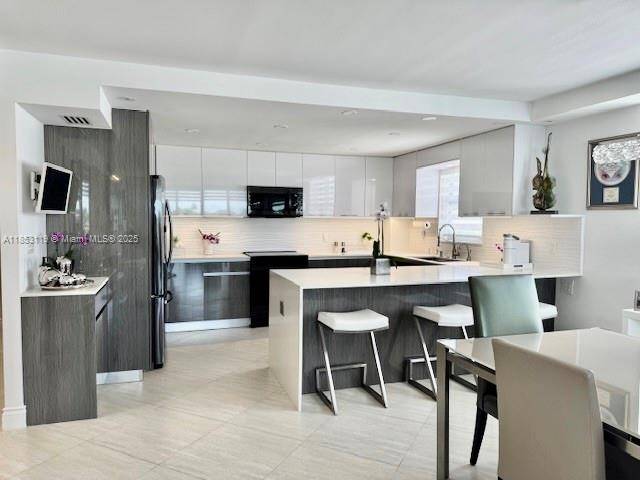 WOW ! NEW NEW NEW ! ENTER THIS COMPLETELY RENOVATED MODERN RESIDENCE IN THE HEART OF BAY HARBOR ISLAND amp ; IMMEDIATELY amp ; THROUGHOUT SEE THE BEST DIRECT WATER ...
