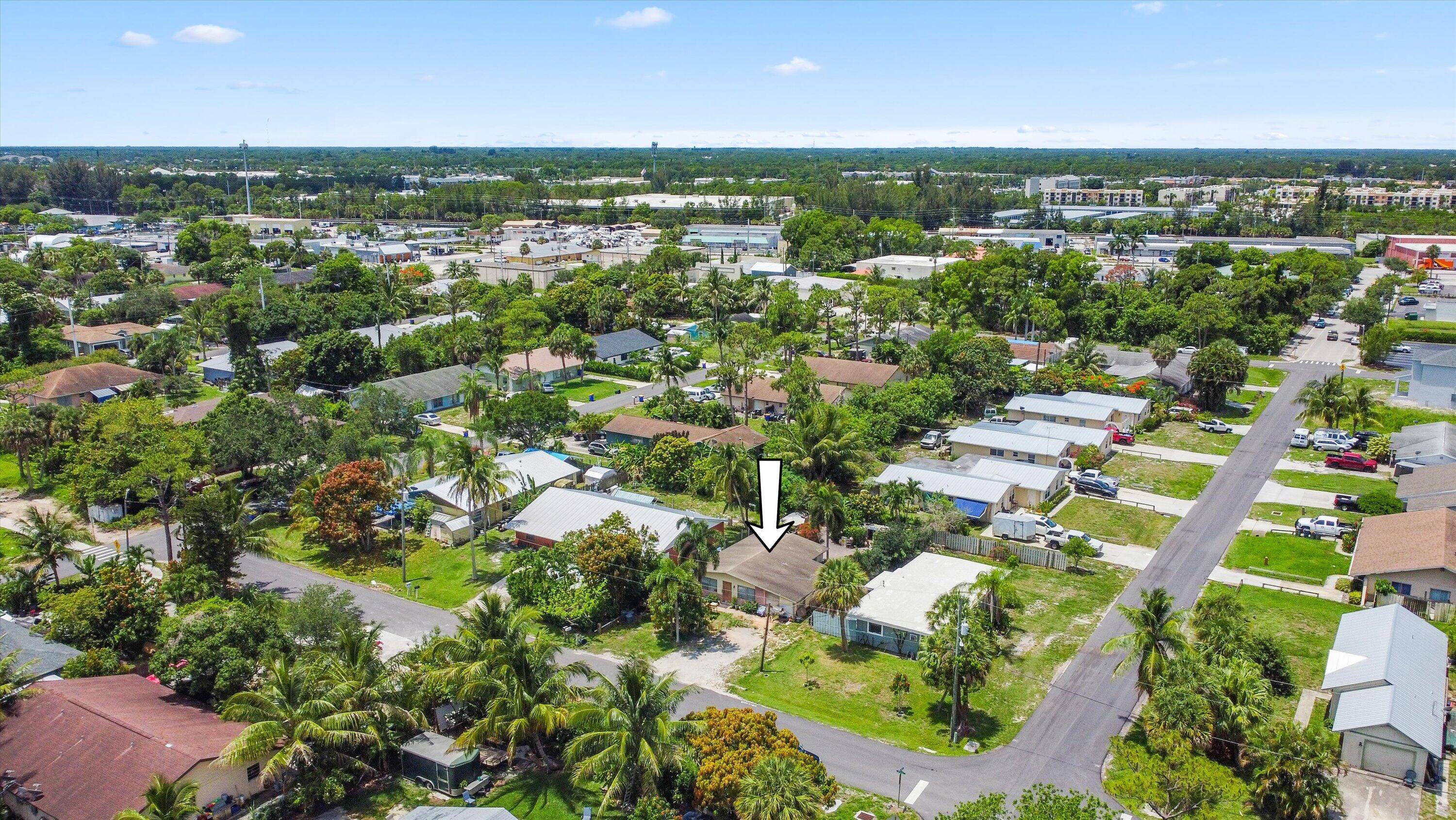 Welcome to 3044 SE Camino Avenue, a charming 2 bedroom, 1 bath CBS home in Stuart's desirable Golden Gate Port Sewalls neighborhood.